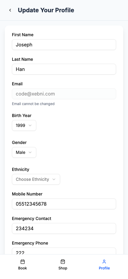 A picture of a venue pro mobile app user's profile. It lists a number of their attributes and gives the option to change them Changable values include; First Name Last Name Birth Year Gender Mobile Number Emergency Contact Emergency Phone With Email and Ethnicity also listed. At the bottom are three tabs; Book Shop Profile Profile is currently selected showing that this menu is accessed through the profile subsystem.